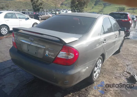 2004 Toyota Camry Le z USA, uszkodzony, nr VIN JTDBE32K940262471